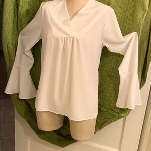 Beautiful white flounce long sleeve blouse.